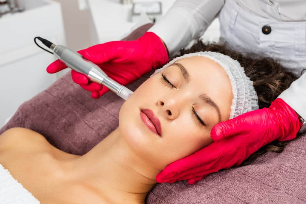 Portfolio 3 Beautiful woman receiving microneedling rejuvenation treatment in MD Beauty Spa in Scottsdale, AZ